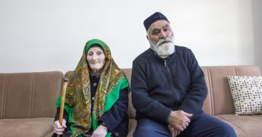 World Ahıska Turks Union President Ziyatdin Kassanov and his wife pose during an interview at their home in Ahlat, eastern Bitlis province, Türkiye, Nov. 12, 2024. (AA Photo)