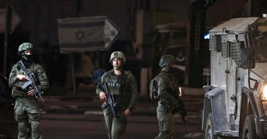 Israeli soldiers stand at the Deir Sharaf checkpoint west of Nablus, West Bank, Palestine, Nov. 12, 2024. (AFP Photo)