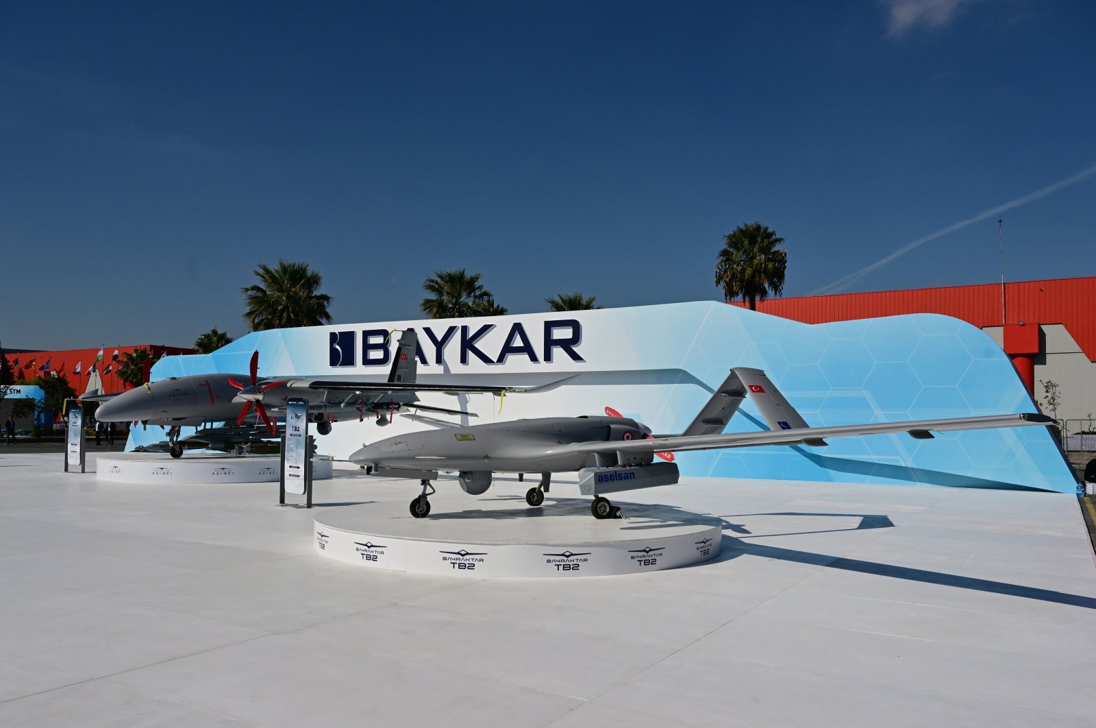 The Bayraktar TB2 drone (R) is on display next to Baykar&#039;s Akıncı unmanned combat aerial vehicle during the SAHA EXPO 2024, an international defense and aerospace exhibition, in Istanbul, Türkiye, Oct. 23, 2024. (AA Photo)