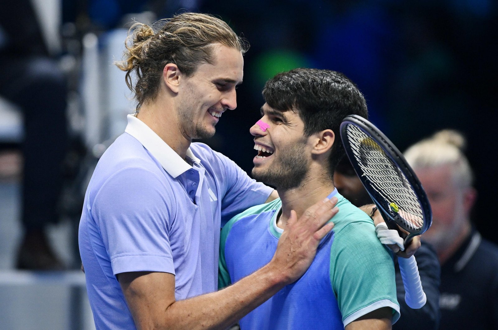 Alexander Zverev of Germany (L) hugs after winning his round-robin match against Carlos Alcarz of Spain at the ATP Finals, Turin, Italy, Nov. 15, 2024. (EPA Photo)