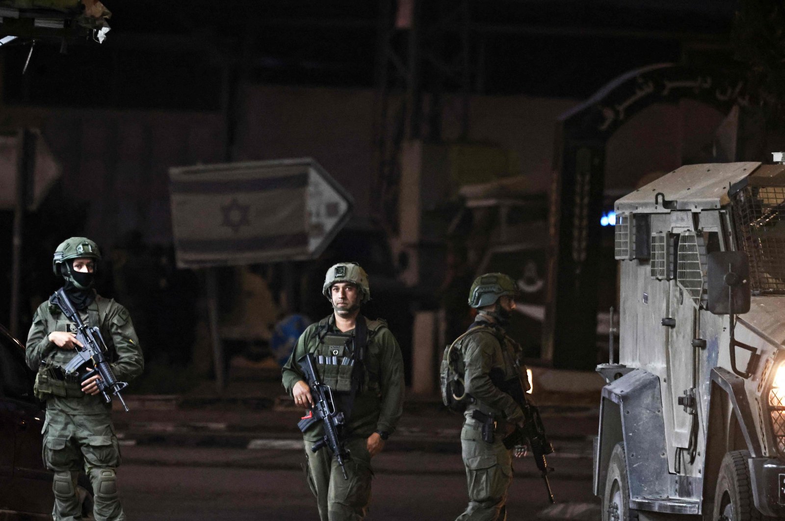 Israeli soldiers stand at the Deir Sharaf checkpoint west of Nablus, West Bank, Palestine, Nov. 12, 2024. (AFP Photo)