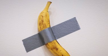 Italian visual artist Maurizio Cattelan&#039;s duct-taped Banana entitled &quot;Comedian,&quot; is on display during a media preview at Sotheby&#039;s in New York, U.S., Nov. 8, 2024. (AFP Photo)