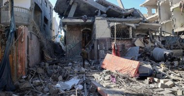 A Palestinian child stands amid the destruction following an Israeli strike in the Bureij refugee camp in the central Gaza Strip, Palestine, Nov. 17, 2024. (AFP Photo)