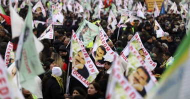 PKK supporters wave posters of the terrorist group&#039;s leader, Abdullah Öcalan, during their rally, Cologne, Germany, Nov. 16, 2024. (AP Photo)