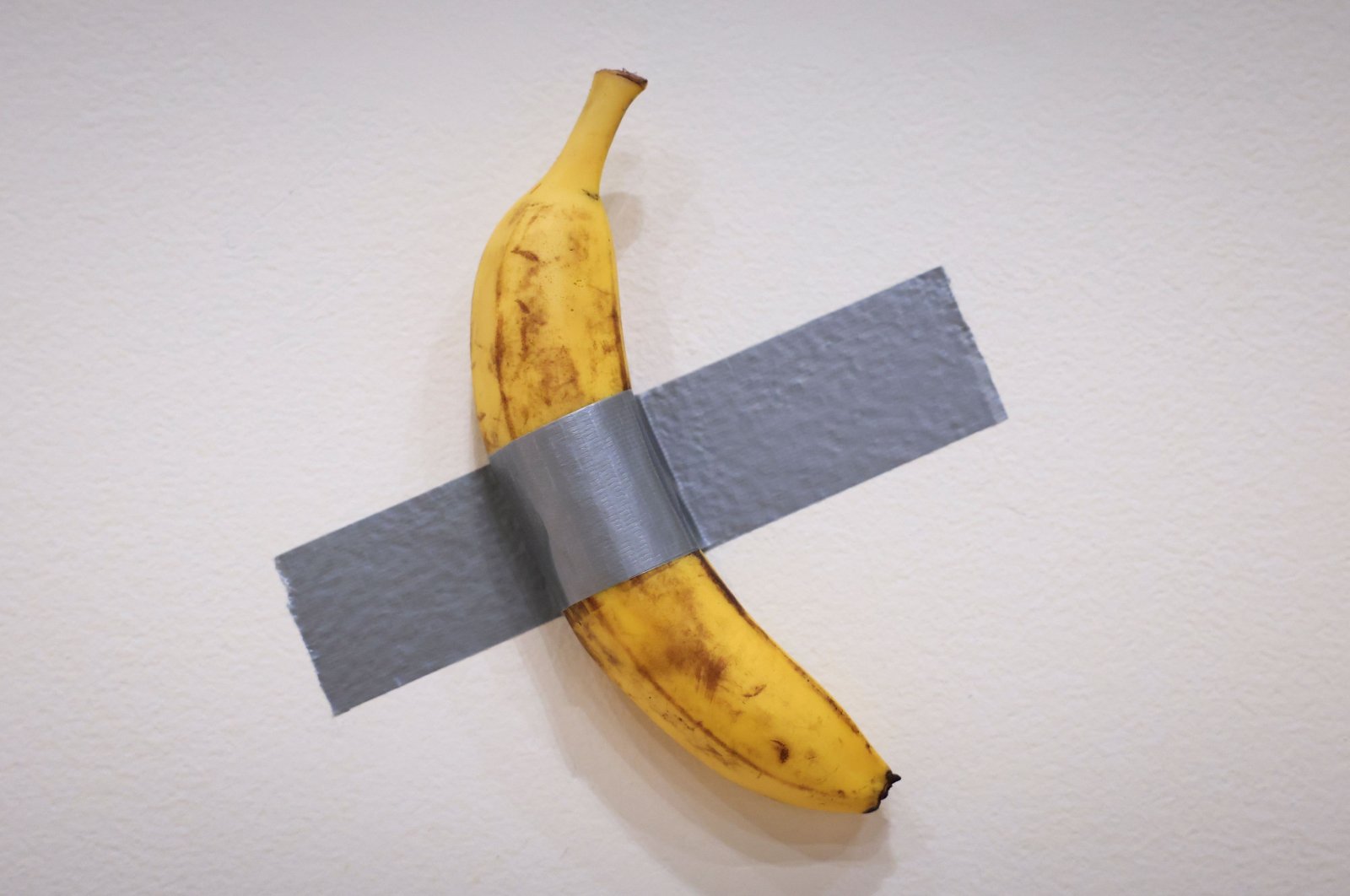 Italian visual artist Maurizio Cattelan&#039;s duct-taped Banana entitled &quot;Comedian,&quot; is on display during a media preview at Sotheby&#039;s in New York, U.S., Nov. 8, 2024. (AFP Photo)