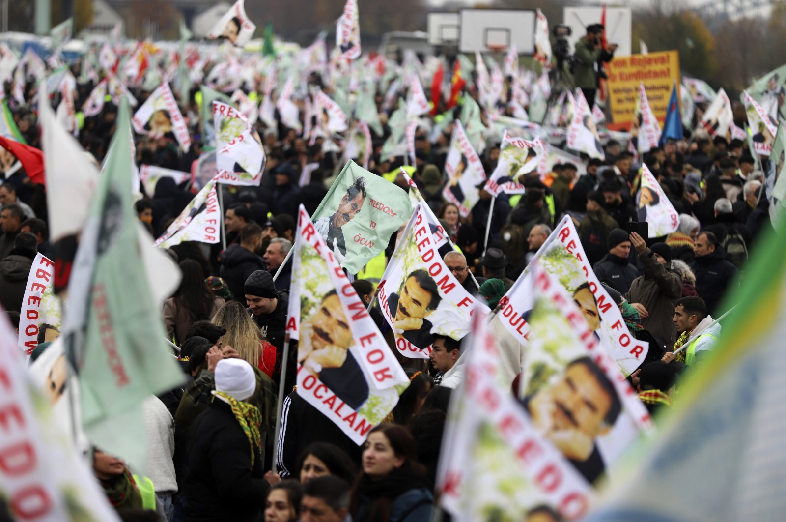 PKK supporters wave posters of the terrorist group&#039;s leader, Abdullah Öcalan, during their rally, Cologne, Germany, Nov. 16, 2024. (AP Photo)