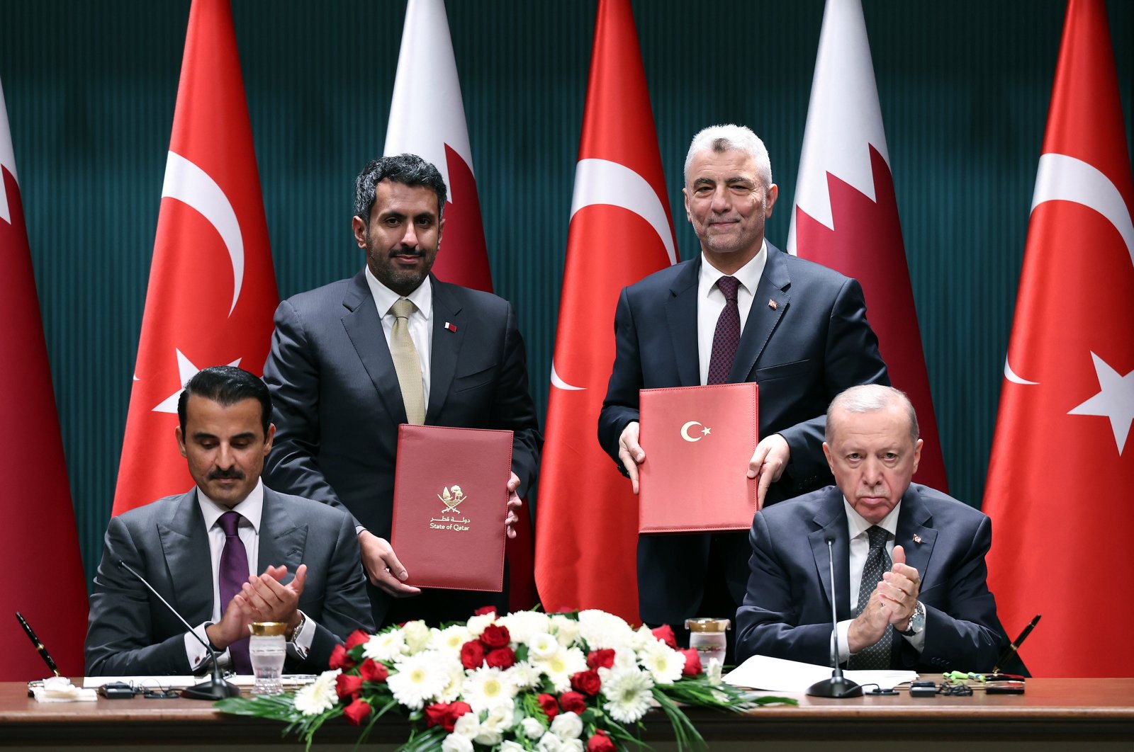 President Recep Tayyip Erdoğan and the emir of Qatar, Sheikh Tamim bin Hamad Al Thani, attend a news conference and ceremony for the agreements, after their meeting at the Presidential Palace, Ankara, Türkiye, Nov. 14, 2024. (AA Photo)