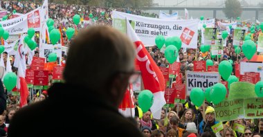 Karl-Josef Laumann, the state minister of labor, health and social affairs in North Rhine-Westphalia, speaks to the protesters as thousands of public sector workers rally against state government budget cuts on public sectors, Duesseldorf, Germany, Nov. 13, 2024. (Getty Images Photo)