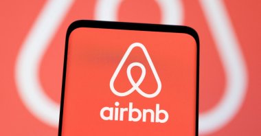 The Airbnb logo is seen displayed in this illustration from May 3, 2022. (Reuters Photo)
