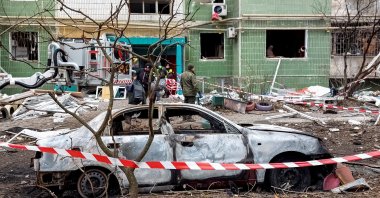 A view shows a destroyed car in front of a residential building, which was damaged by a Russian missile strike, amid Russia&#039;s attack on Ukraine, Sumy, Ukraine, Nov. 18, 2024. (Reuters Photo)