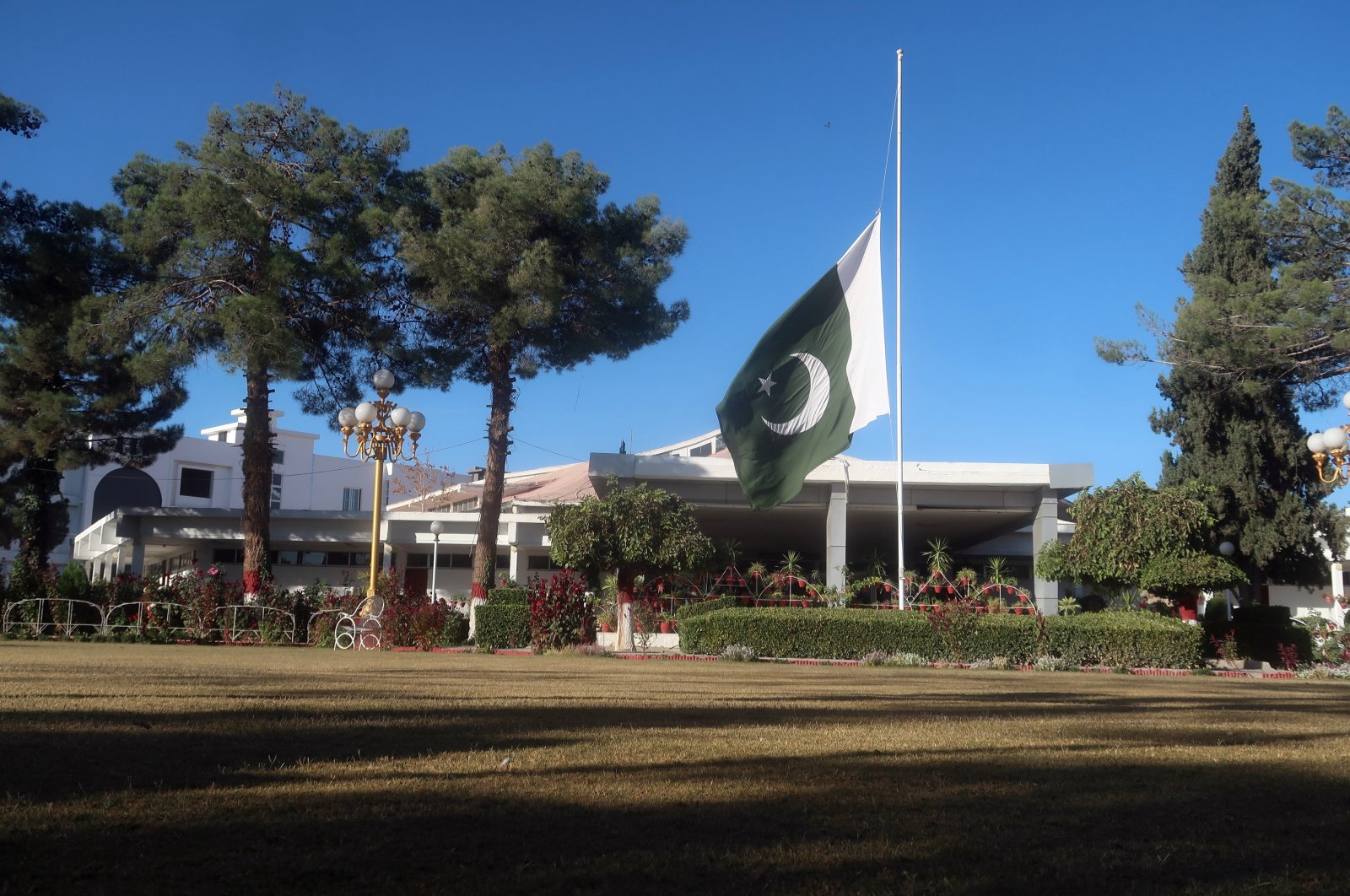 A Pakistani flag flies half-mast at a provincial assembly building after the government announced a 3-day mourning following a suicide bombing at a railway station in Quetta, the provincial capital of restive Balochistan province, Pakistan, Nov. 11, 2024. (EPA Photo)