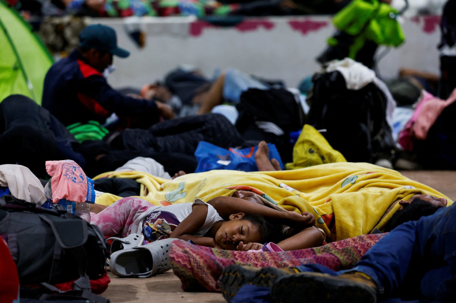 Migrants in a caravan sleep in a public square after deciding to take a break to regain energy during their journey to the U.S. border, in Escuintla, Mexico Nov. 8, 2024. (Reuters Photo)