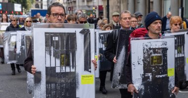 Supporters of the Free Political Prisoners campaign arrive to stage a public protest exhibition of images of past and present political prisoners in the road outside the Attorney General&#039;s office and Ministry of Justice on United Nations Day, London, U.K., Oct. 24, 2024. (Getty Images Photo)