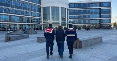 Security officers escort a captured FETÖ suspect to the courthouse in Kayseri, central Türkiye, Nov. 7, 2024. (AA Photo)