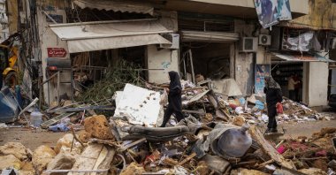 Women walk past a damaged building in the aftermath of an Israeli strike in the Zuqaq al-Blat area, Beirut, Lebanon, Nov. 19, 2024. (Reuters Photo)