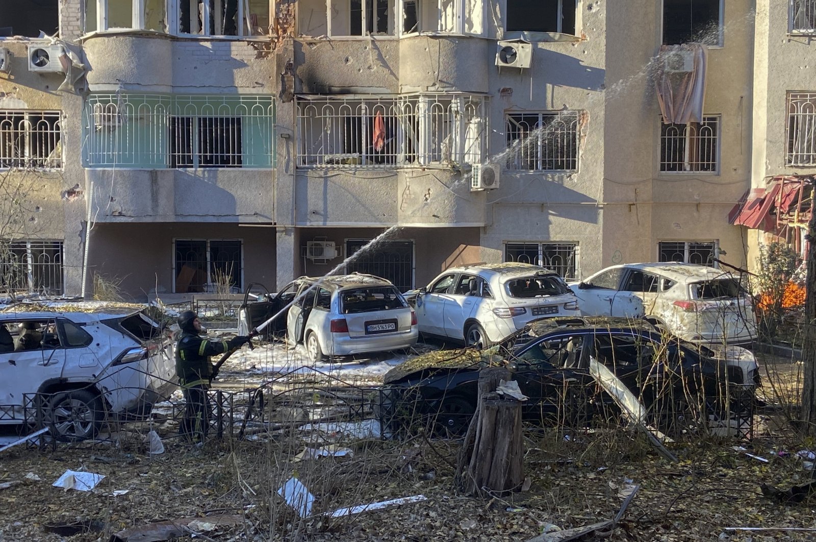 Ukrainian rescuers work at the site of a missile strike in a residential area in Odesa, Ukraine, Nov. 18 2024. (EPA Photo) 