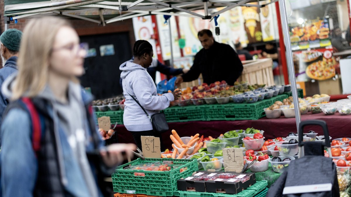 People shop at Walthamstow Market in east London, U.K., Oct. 29, 2024. (EPA Photo)