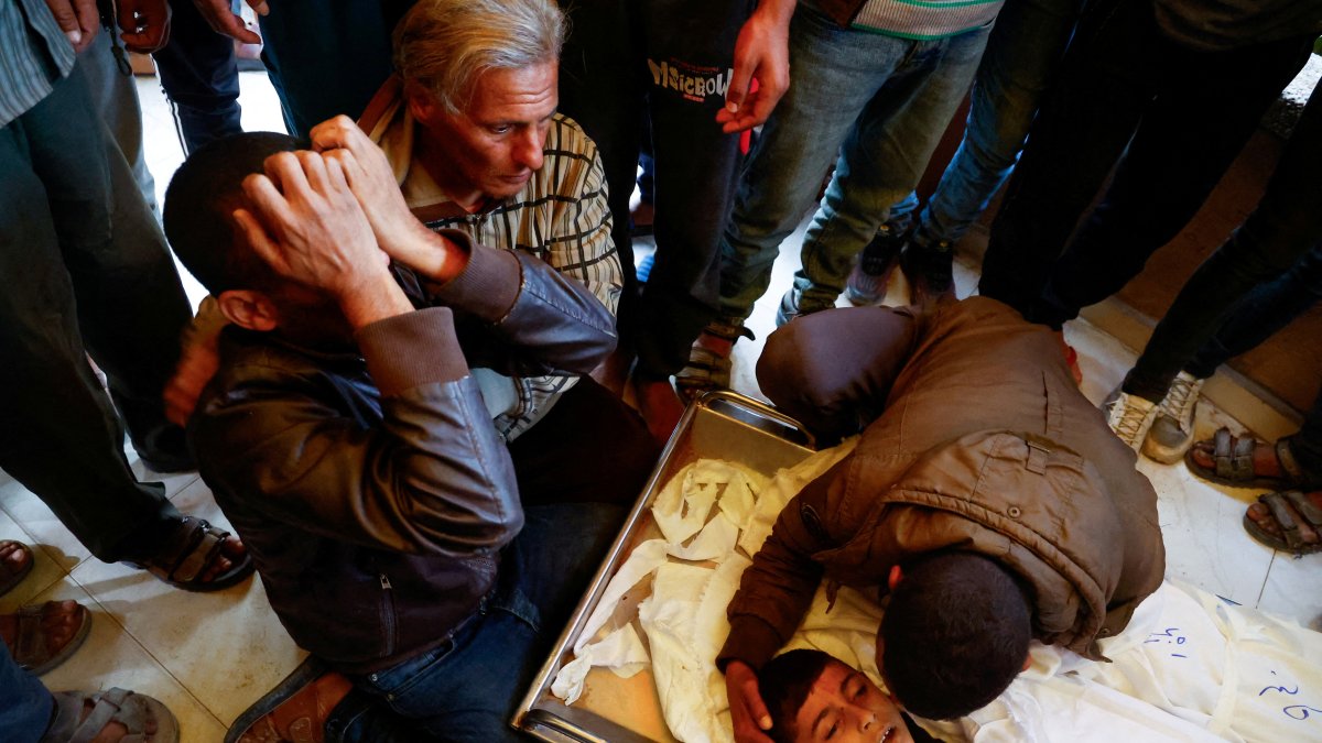 People mourn next to the bodies of Palestinians killed in an Israeli strike, at Nasser hospital in Khan Younis in the southern Gaza Strip, Nov. 20, 2024. (Reuters Photo)