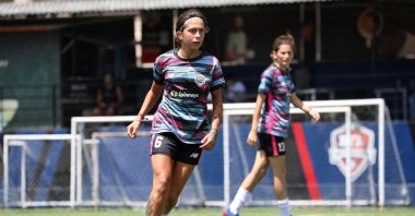 An undated handout photo obtained from the Lebanese Football Association (LFA) on Nov. 19, 2024, shows Lebanese footballer Celine Haidar running with the ball during a football match in Lebanon. (AFP Photo)