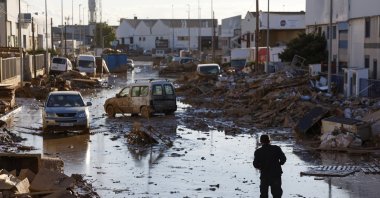A person walks along a muddy street in the flood-hit city of Catarroja, Valencia, Spain, Nov. 11, 2024. (EPA Photo)