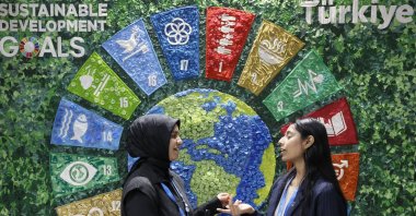 Participants stand near the Türkiye pavilion during the United Nations Climate Change Conference COP29, Baku, Azerbaijan, Nov. 14, 2024. (EPA Photo)