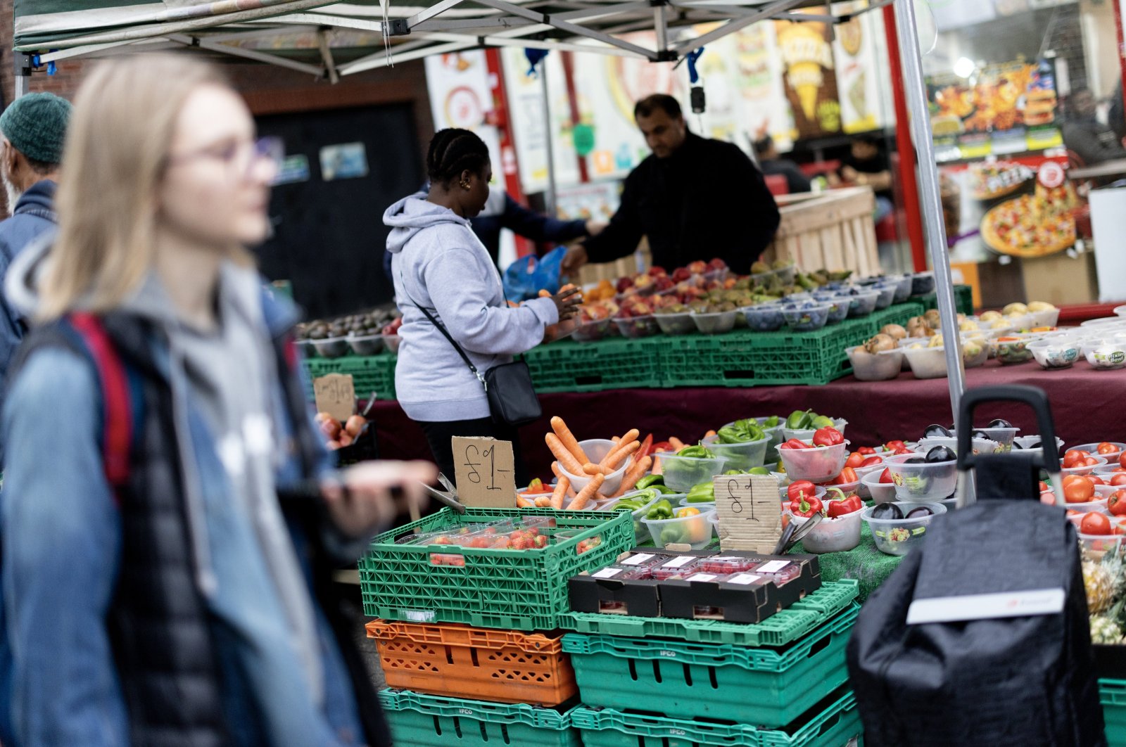 People shop at Walthamstow Market in east London, U.K., Oct. 29, 2024. (EPA Photo)