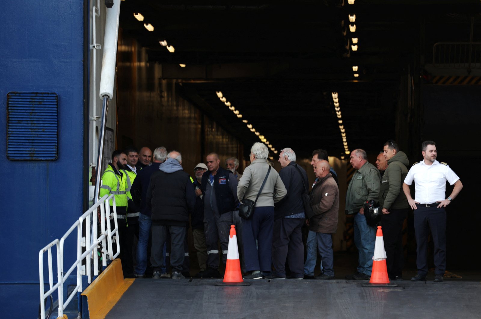 People are seen in a ship as passenger ships are moored during a 48-hour strike at the port of Piraeus, Athens, Greece, Oct. 22, 2024. (Reuters Photo)