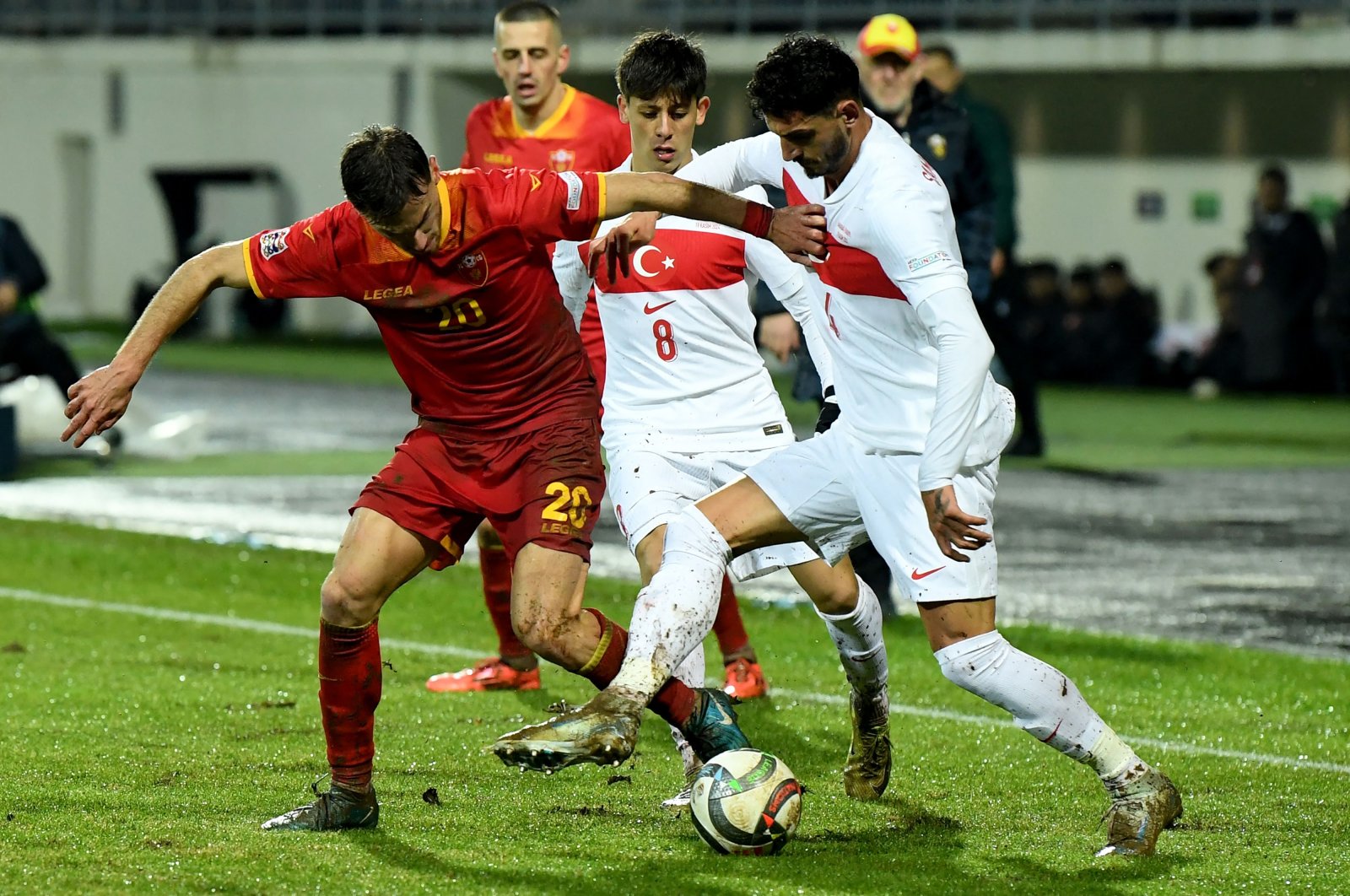 Montenegro&#039;s midfielder Ognjen Gasevic (L) fights for the ball with Türkiye&#039;s midfielder Arda Güler (C) and defender Samet Akaydın during the UEFA Nations League League B Group 4 match at the City Stadium, Niksic, Montenegro, Nov. 19, 2024. (AFP Photo)