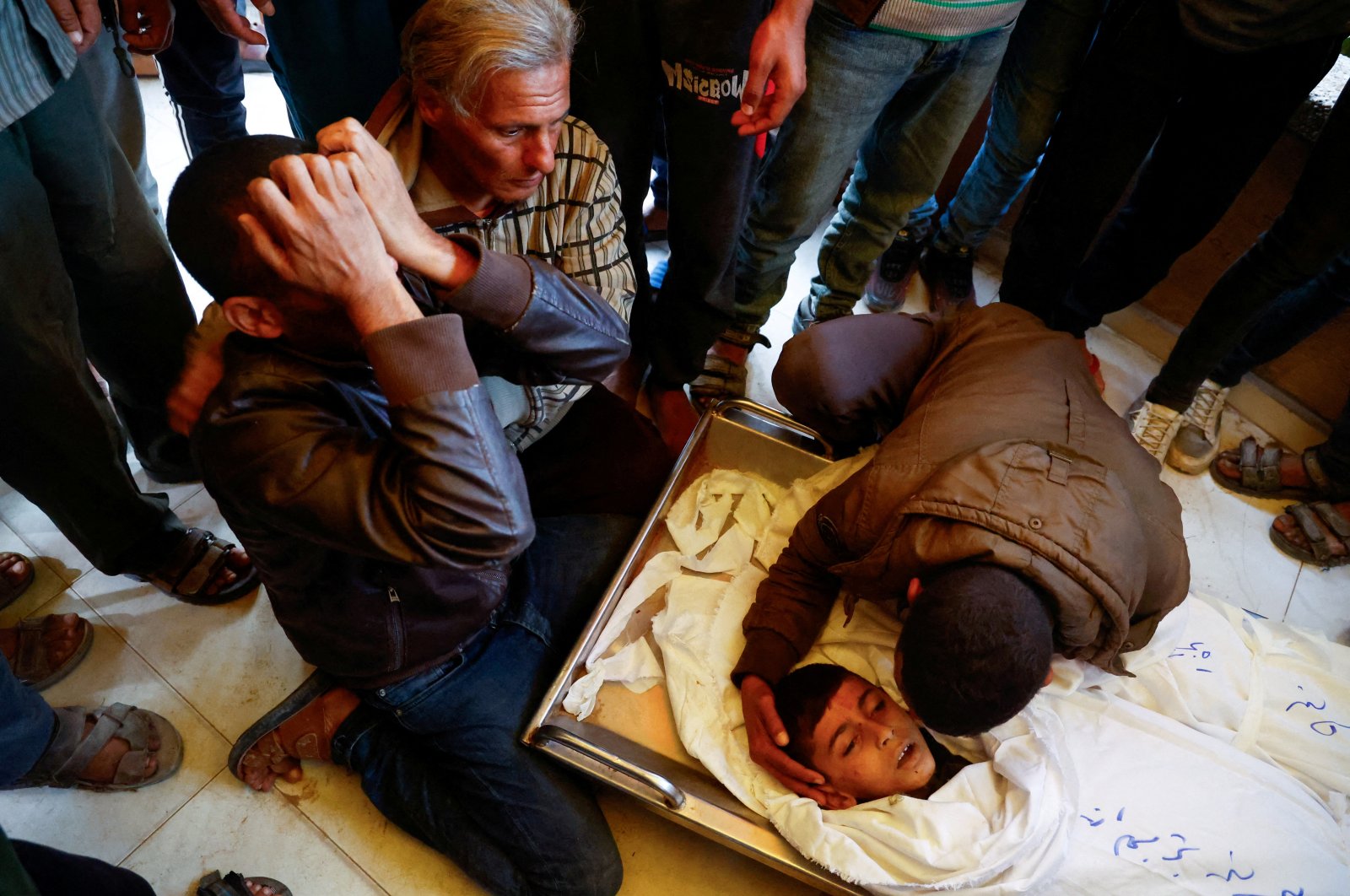 People mourn next to the bodies of Palestinians killed in an Israeli strike, at Nasser hospital in Khan Younis in the southern Gaza Strip, Nov. 20, 2024. (Reuters Photo)