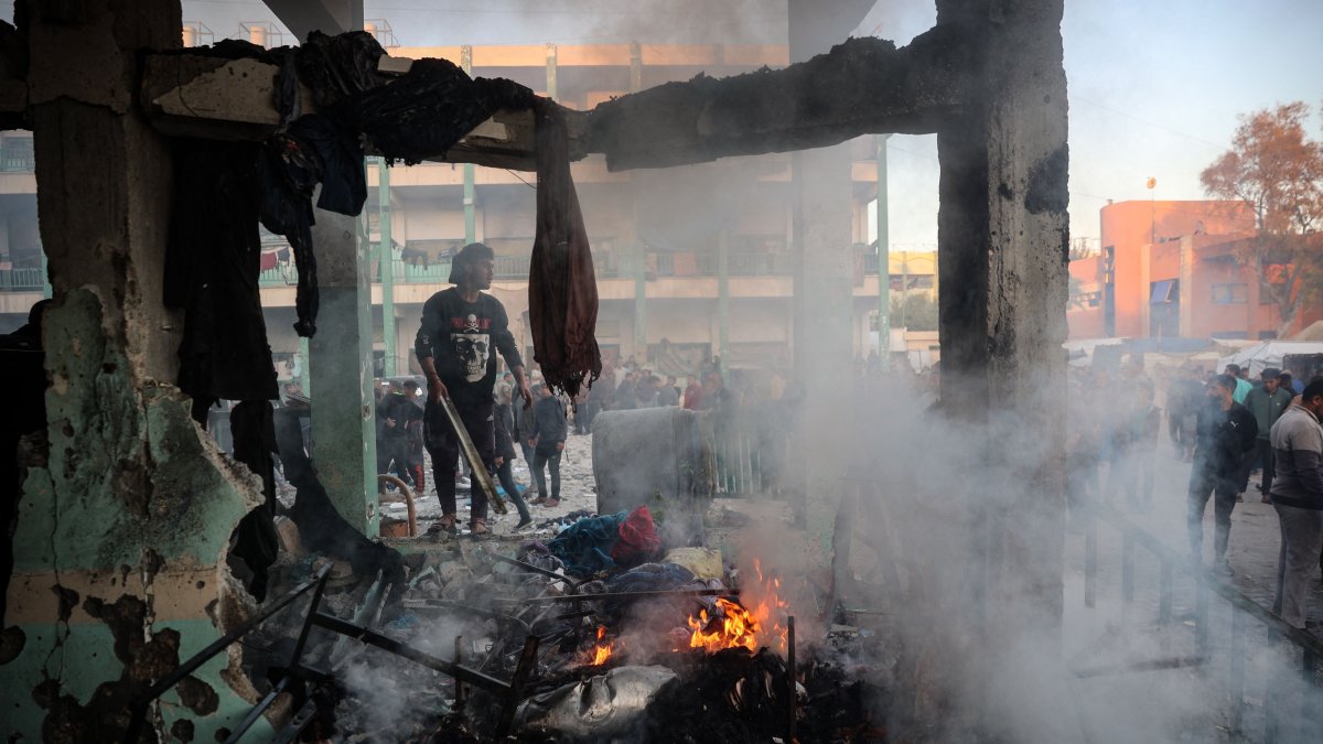 A fire burns amid the debris following an Israeli strike that hit a U.N.-run school where people had taken refuge, in the Nusseirat refugee camp in the central Gaza Strip, Nov. 20, 2024. (AFP Photo)