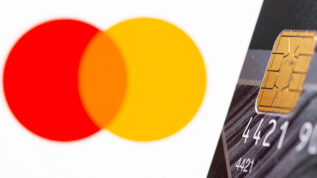 A credit card in front of the displayed Mastercard logo in this illustration taken on July 15, 2021. (Reuters Photo)