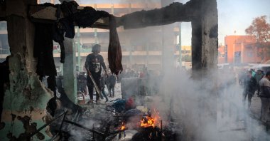 A fire burns amid the debris following an Israeli strike that hit a U.N.-run school where people had taken refuge, in the Nusseirat refugee camp in the central Gaza Strip, Nov. 20, 2024. (AFP Photo)