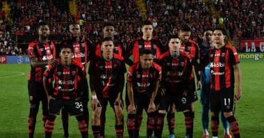 Alajuelense players pose for a team photo ahead of the Concacaf Central American Cup second leg semifinal match against Antigua GFC, at the Alejandro Morera Soto stadium, Alajuela, Costa Rica, Oct. 30, 2024. (AFP Photo)