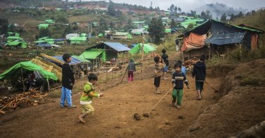 Children playing near IDPs camp in Demoso Township, Kayah State, Myanmar, Nov. 19, 2022. (Reuters Photo) 