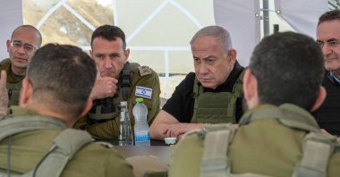 This handout picture released by the Government Press Office (GPO) shows Israel's Prime Minister Benjamin Netanyahu (R), Defense Minister Israel Katz (R) and army Chief-of-Staff Herzi Halevi (2nd L) during a briefing in the Netzarim Corridor just south of Gaza City, Nov. 19, 2024. (AFP Photo)