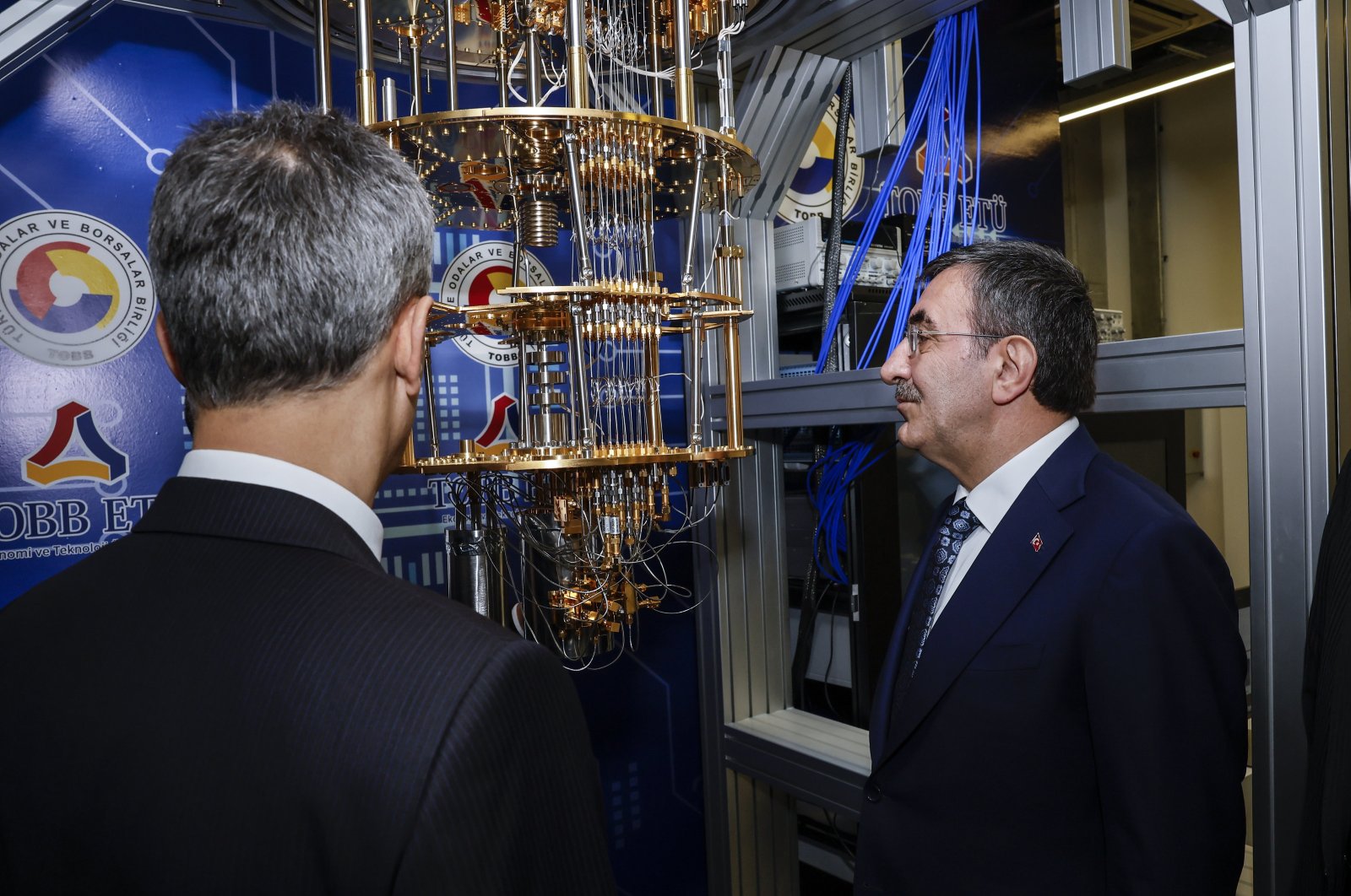 Vice President Cevdet Yılmaz (R) looks at the quantum computer developed by the TOBB University of Economics and Technology (ETU), unveiled in Ankara, Türkiye, Nov. 21, 2024. (AA Photo)