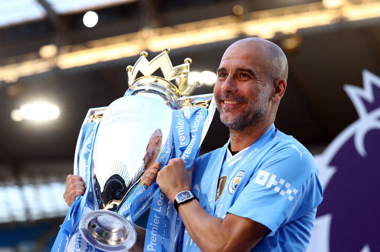 Manchester City manager Pep Guardiola celebrates with the trophy after winning the Premier League at the Etihad Stadium, Manchester, Britain, May 19, 2024. (Reuters Photo)