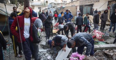 People check the site on an Israeli strike at a house in Nuseirat, Gaza Strip, Palestine, Nov. 22, 2024. (AFP Photo)