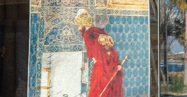 A woven rug depicting the famous Turkish painting &#039;The Tortoise Trainer&#039; by Osman Hamdi Bey. (Shutterstock)