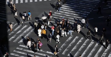 People walk through a crossing at Ginza shopping district, Tokyo, Japan, Nov. 22, 2024. (EPA Photo)