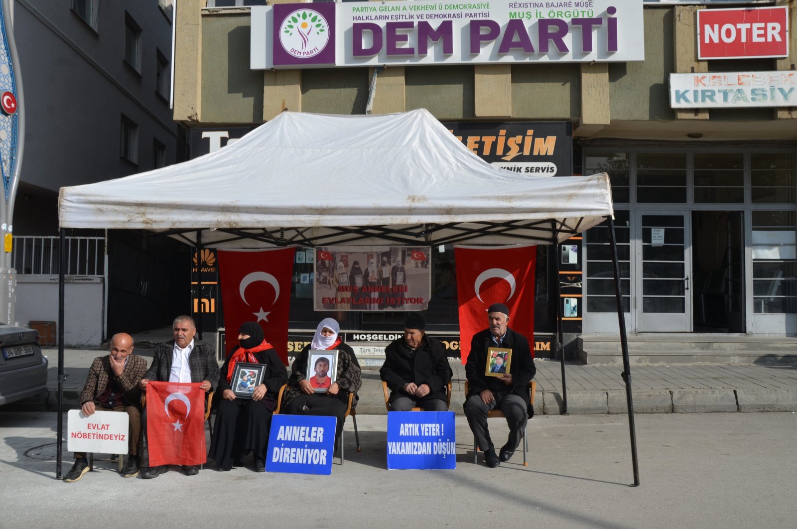 Families hold photographs of their children abducted by PKK terrorists during a sit-in protest outside a Peoples&#039; Equality and Democracy Party (DEM Party) office, Muş, southeastern Türkiye, Nov. 20, 2024. (AA Photo)