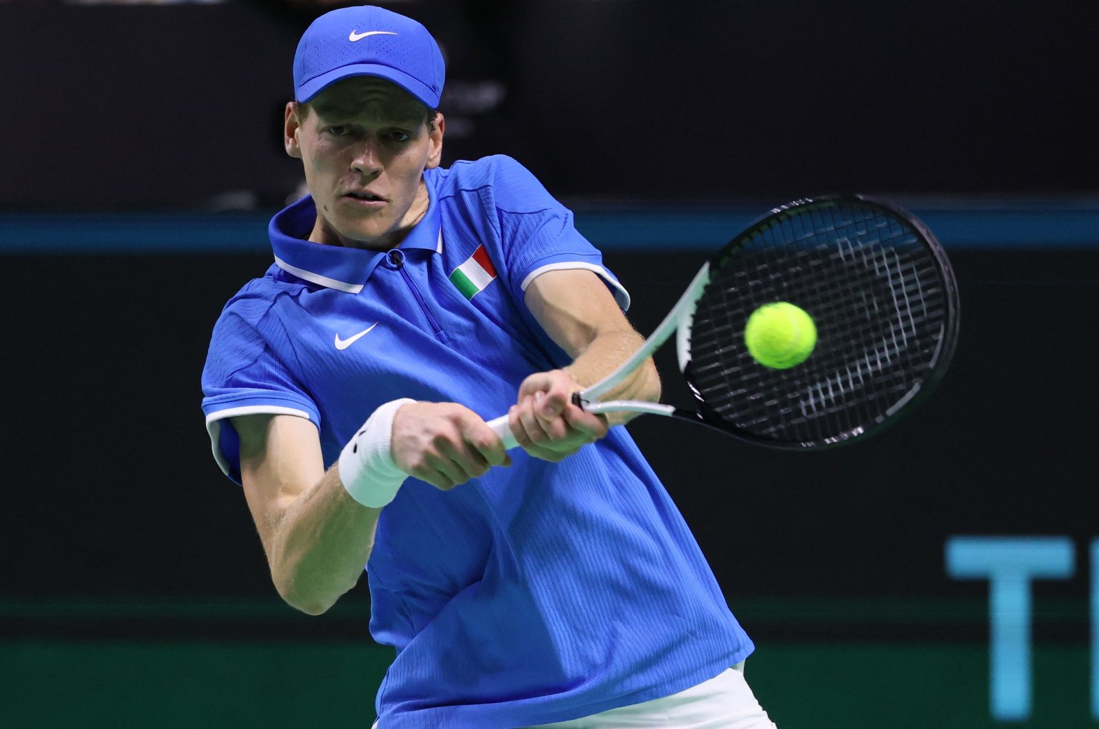 Jannik Sinner returns the ball to Sebastian Baez during their quarter-final singles match between Italy and Argentina at the Davis Cup Finals at the Palacio de Deportes Jose Maria Martin Carpena arena, Malaga, Spain, Nov. 21, 2024. (AFP Photo)