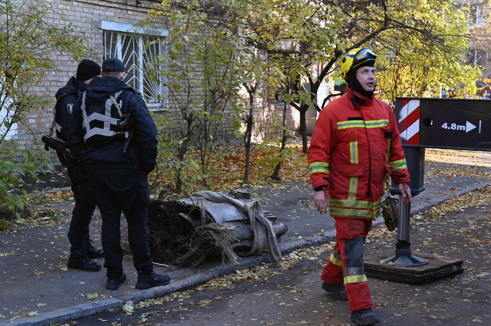 Police officers secure a large fragment of a downed Russian hypersonic missile Zircon after it struck a five-story residential building during a "massive" aerial barrage, Kyiv, Ukraine, Nov. 17, 2024. (AFP Photo)