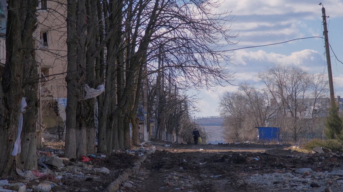 A local resident walks along a damaged street in the town of Siversk, Donetsk region, Ukraine, March 5, 2023. (Reuters Photo)