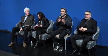 Film director Zeki Demirkubuz (2nd R) speaks at an event to premier his Oscar entry "Life," at Turkish House (Türkevi), New York, U.S., Nov. 22, 2024. (AA Photo)