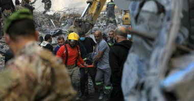 Rescuers remove the body of a victim from the rubble of a building destroyed in an Israeli airstrike, Beirut, Lebanon, Nov. 23, 2024. (AFP Photo)
