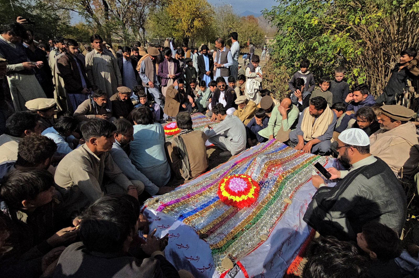 Mourners pray at the mass burial of the victims killed in a gunmen firing incident, in Kurram, Parachinar, Pakistan, Nov. 22, 2024. (EPA Photo)