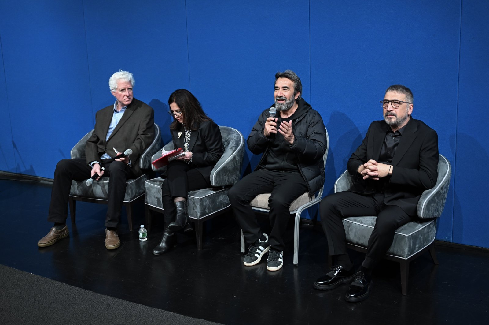 Film director Zeki Demirkubuz (2nd R) speaks at an event to premier his Oscar entry &quot;Life,&quot; at Turkish House (Türkevi), New York, U.S., Nov. 22, 2024. (AA Photo)