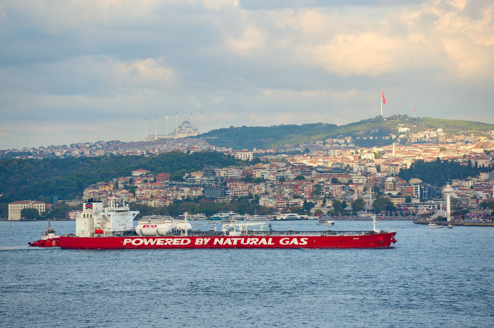 A large red tanker labeled &quot;Powered by Natural Gas&quot; sails through the Bosporus in Istanbul, Türkiye, Sept. 2, 2024. (Reuters Photo)