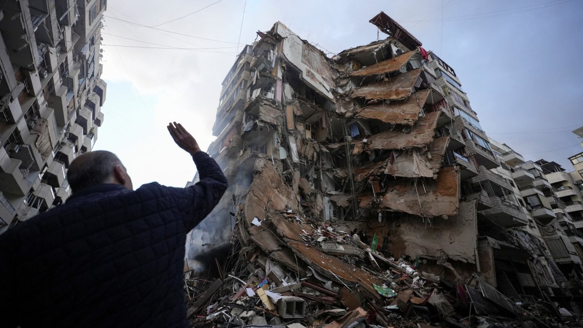 A man gestures near a building destroyed by Israeli airstrikes on Beirut&#039;s southern suburbs, Lebanon, Nov. 25, 2024. (Reuters Photo)